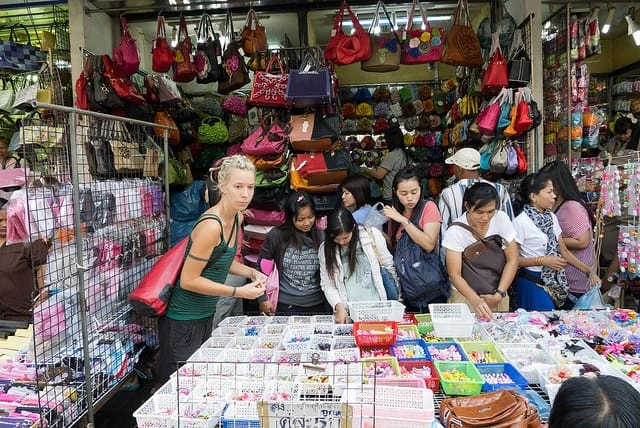 CMLocals Chiang Mai Locals cost of living local market stall with colorful handmade bags and vendors